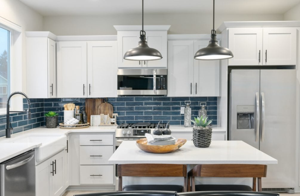 4-Airy kitchen with blue subway tiles in new home
