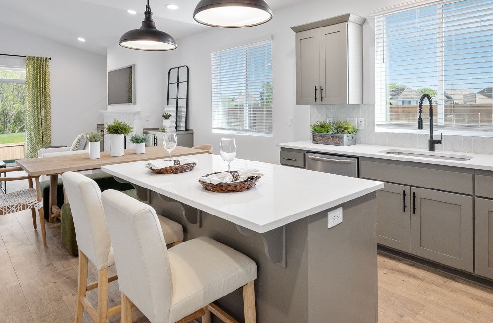 Kitchen in new home for sale with warm colored cabinets