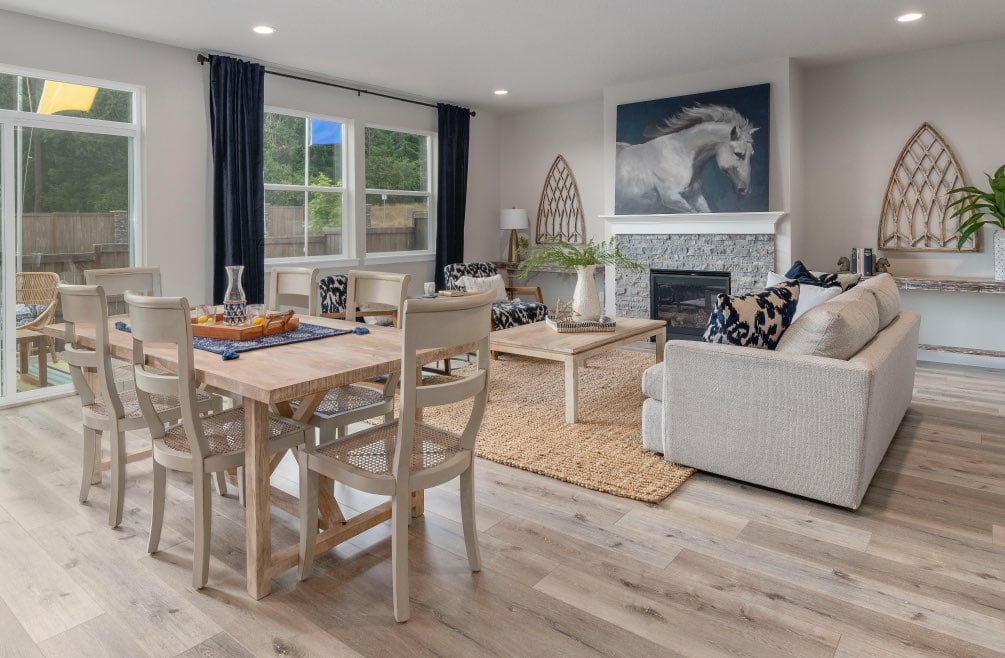 Open living area of new home with light wood floors