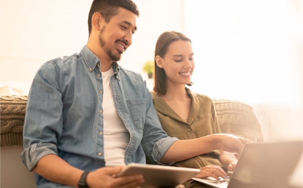 Young couple looking at computer